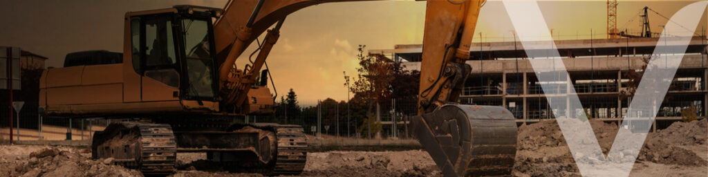 a bulldozer on a construction site at dusk doing excavation work 