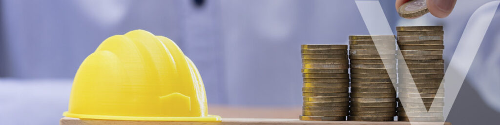 Engineer's helmet balanced on a scale next to coins, representing the importance of value engineering in the efficient management of costs in construction projects. 